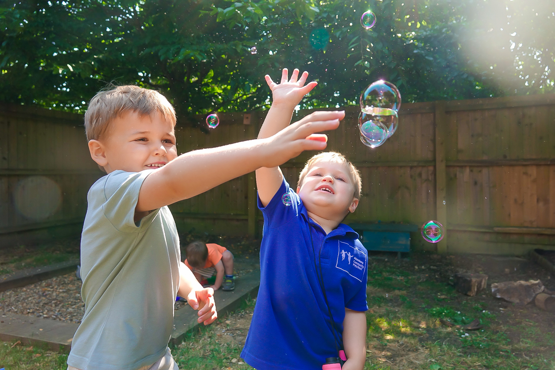 Children playing outdoors at Alconbury Community Preschool